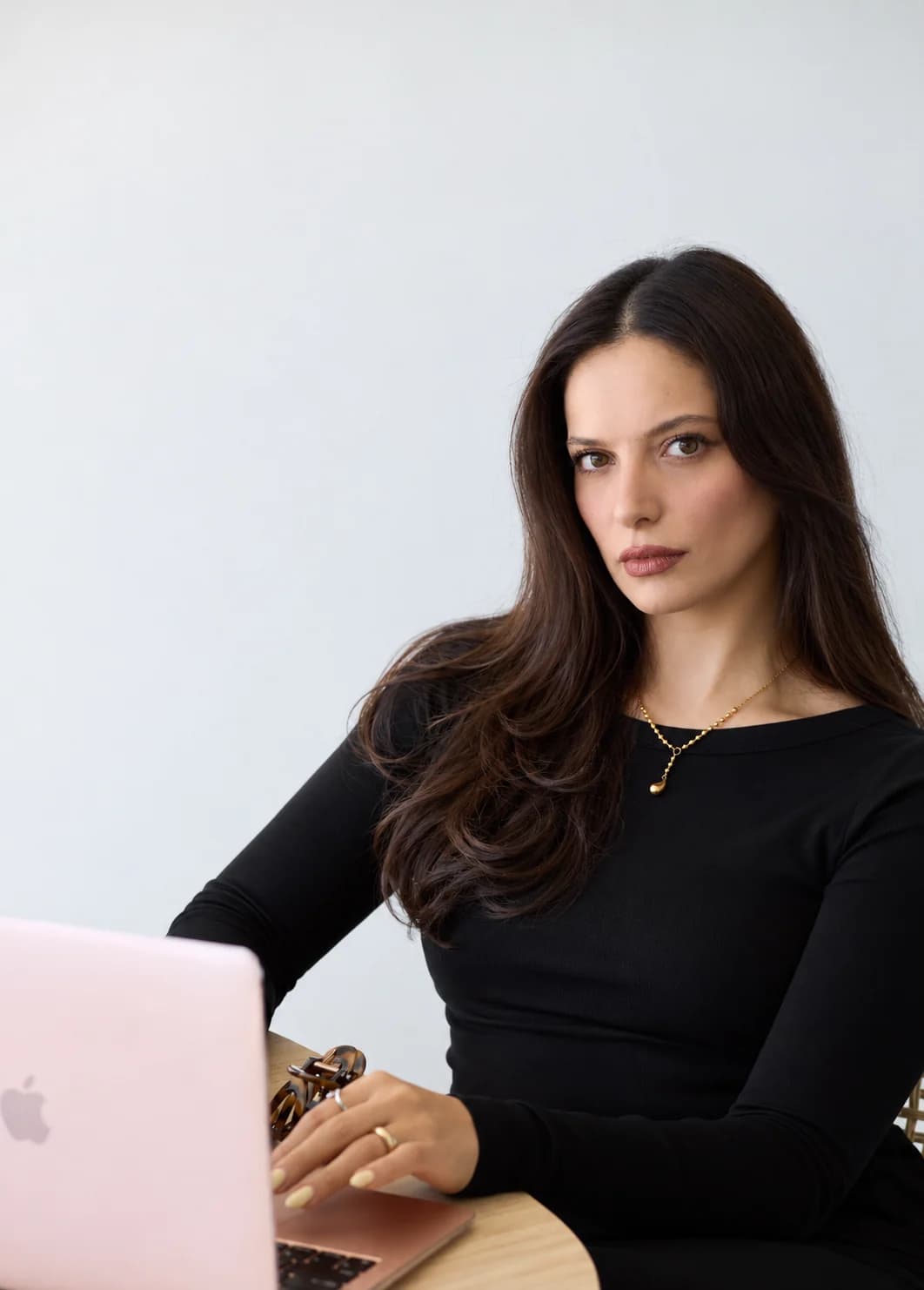 Nura Issa working at her laptop